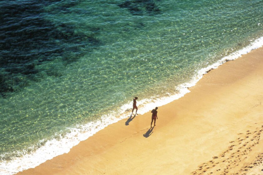 2.Persons.Walking.On Long.Beach. Portugal