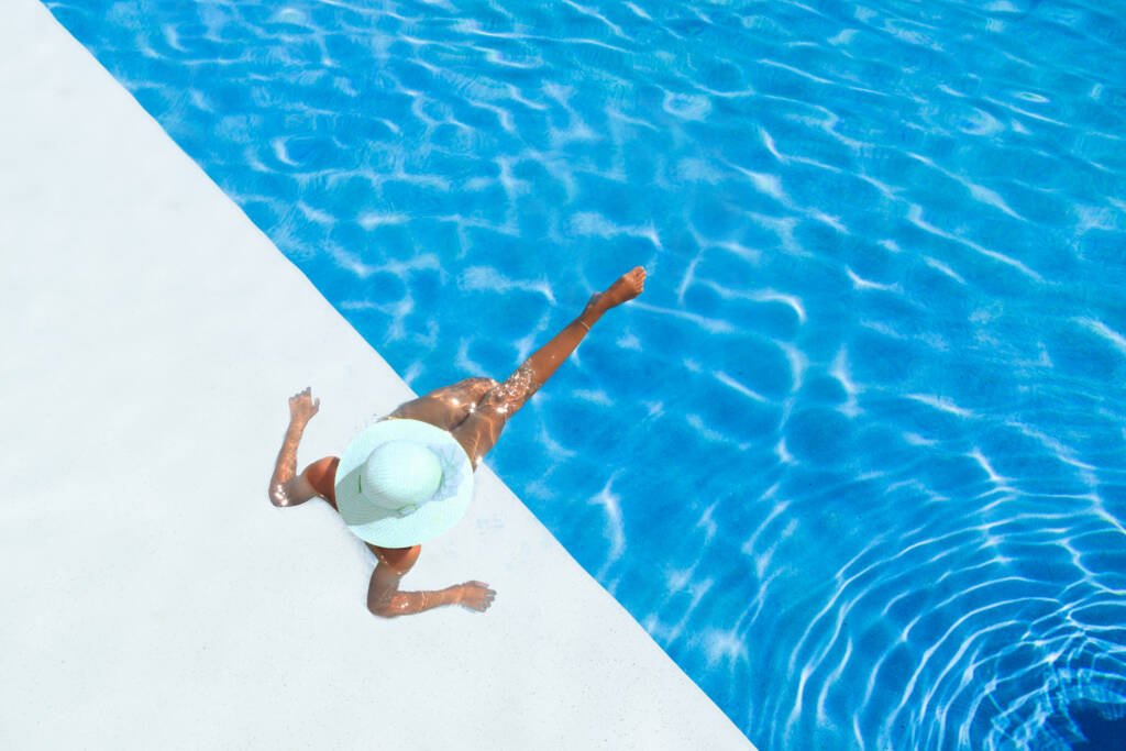 Beautiful,Tanned,Sporty,Slim,Woman,Relaxing,In,Swimming,Pool,Spa.Ideal.Wellness.Travel.